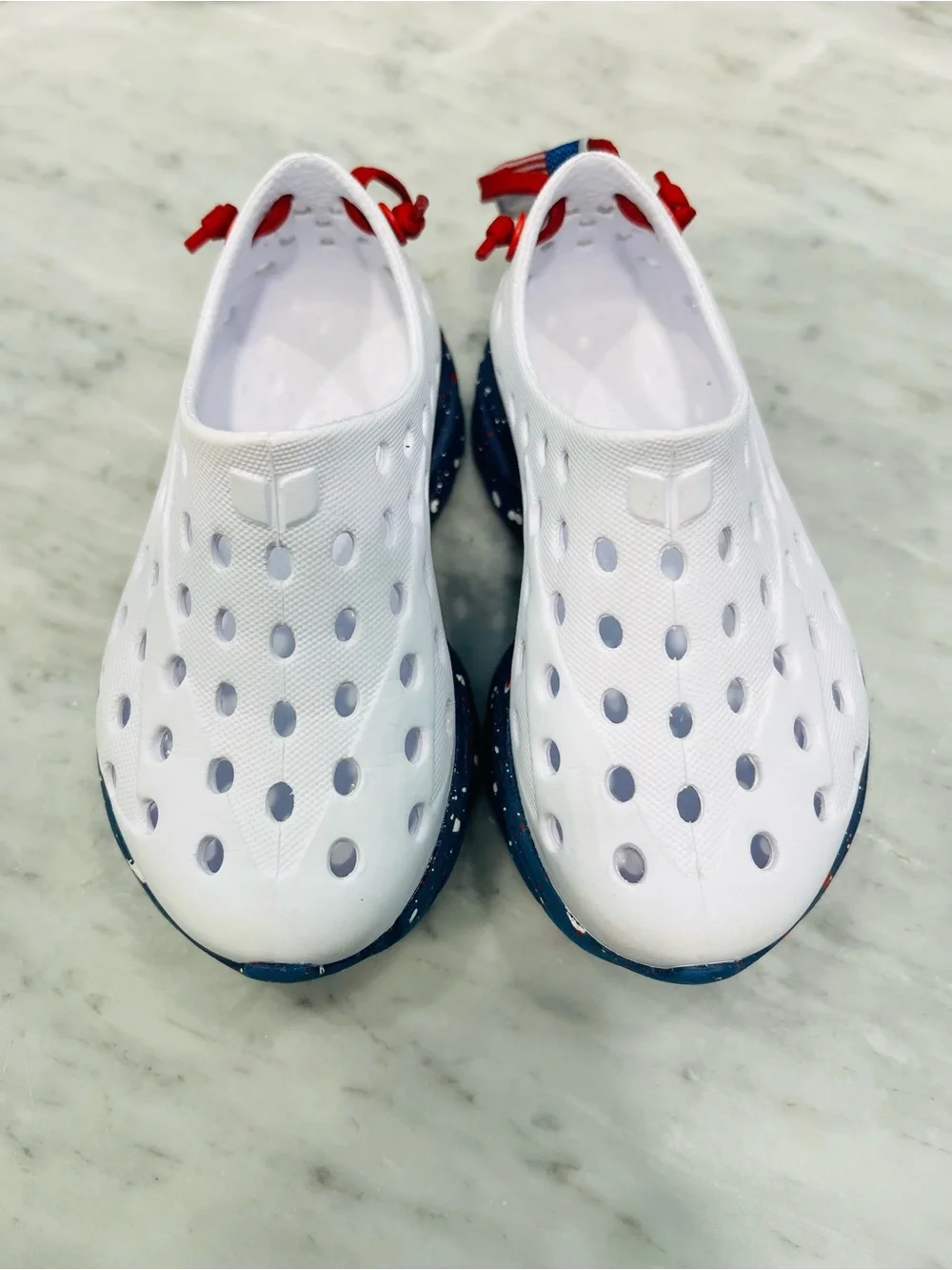 Kids White Slip-On Water Shoes with Navy Speckled Sole and Red Pull Tab